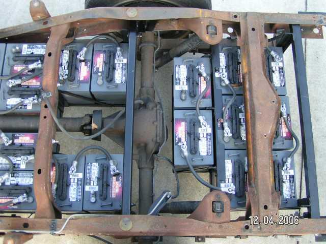 Batteries behind the axle.