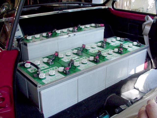 Batteries behind front seat (cover off)