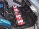 Batteries under front seat